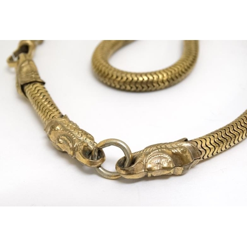 1060 - A gilt metal watch chain / choker with serpent/dolphin decoration. Approx 15'' long