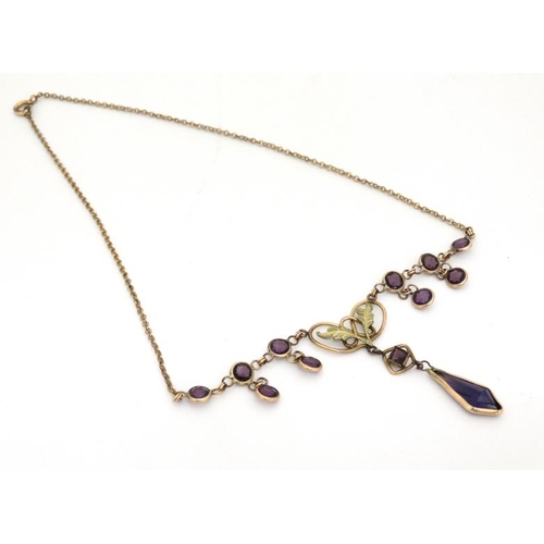 1086 - A gilt metal necklace set with facet cut amethyst coloured detail and drop . Approx 16'' long