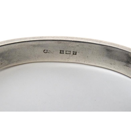 1094 - A silver bracelet of bangle form hallmarked Birmingham 1956 maker Joseph Gloster Ltd.