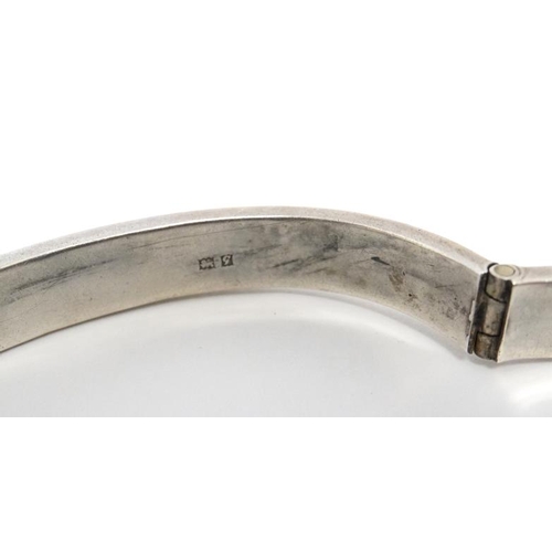 1094 - A silver bracelet of bangle form hallmarked Birmingham 1956 maker Joseph Gloster Ltd.