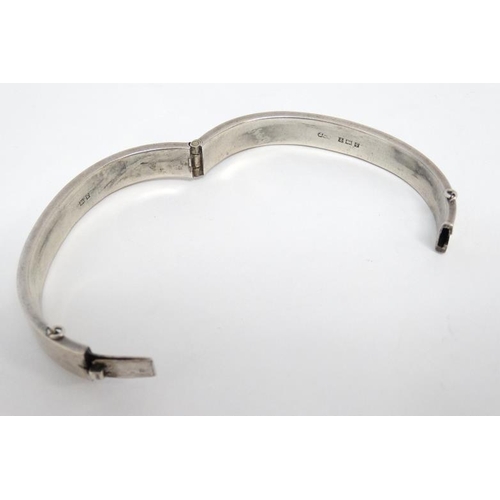 1094 - A silver bracelet of bangle form hallmarked Birmingham 1956 maker Joseph Gloster Ltd.