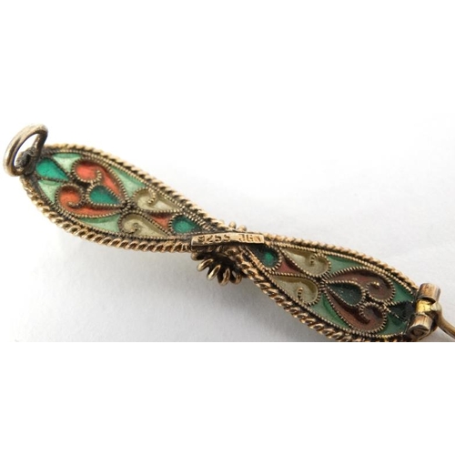 1097 - A .925 silver gilt brooch with enamel decoration maker JGK 2'' wide