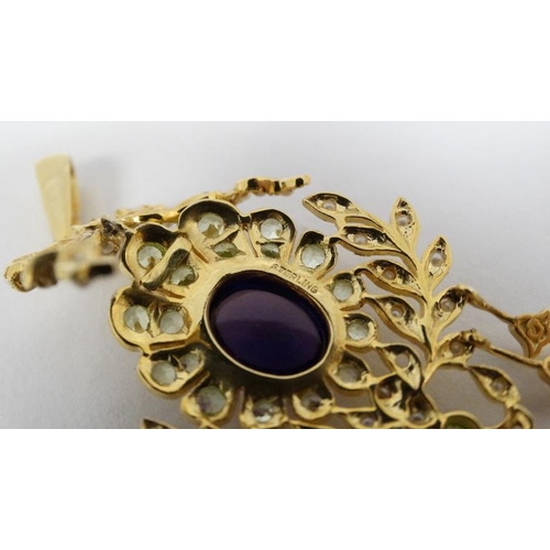 1102 - A silver gilt pendant set with amethyst cabochon to centre and a profusion of peridot and seed pearl... 