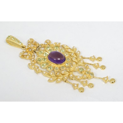 1102 - A silver gilt pendant set with amethyst cabochon to centre and a profusion of peridot and seed pearl... 