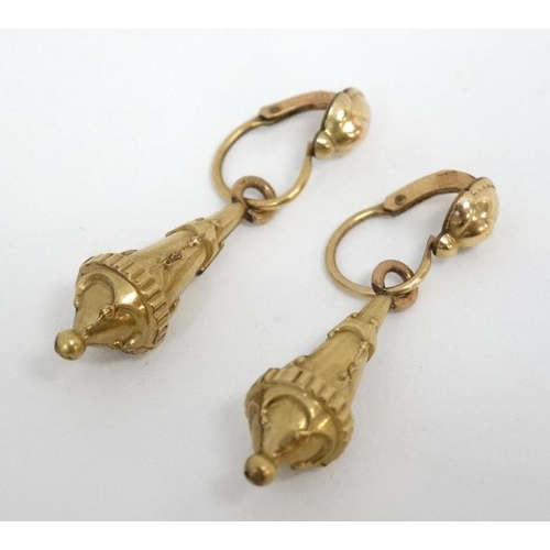 1105 - A pair of yellow metal drop earrings. Indistinctly marked . approx. 1 /4'' long