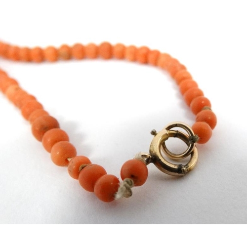 1108 - An early 20thC necklace of graduated coral beads. Approx 18'' long