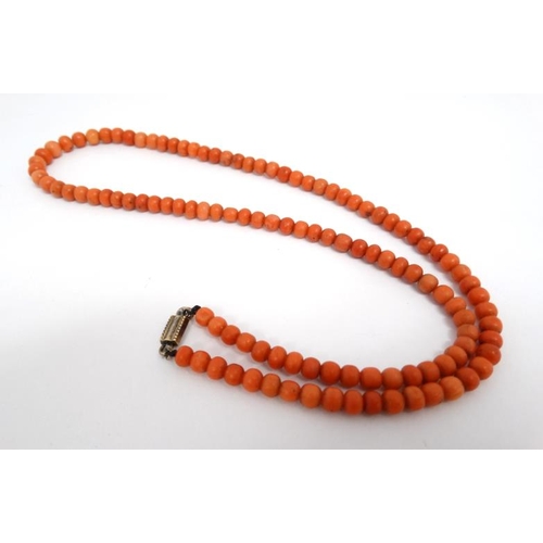 1109 - An early 20thC necklace of graduated coral beads. Approx 20'' long