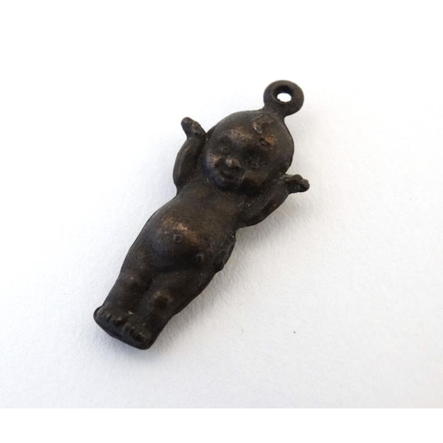 1111 - A pendant / charm formed as a kewpie doll 1 ¼'' long