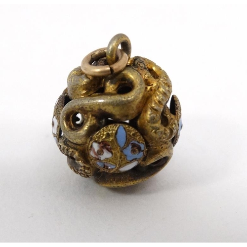 1113 - A gilt metal pendant of spherical form with enamel decoration. Approx  ½'' diameter