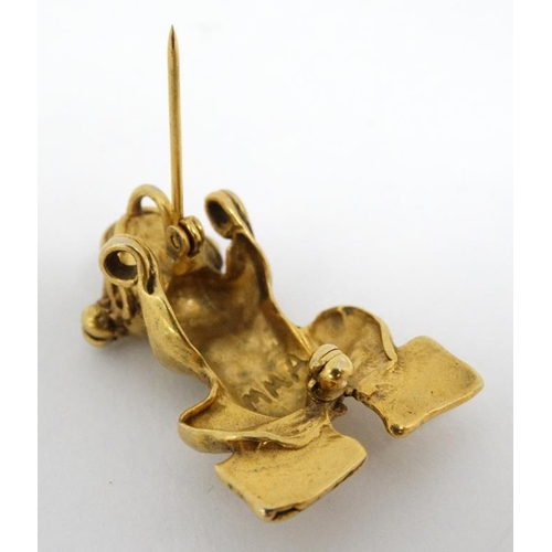 1114 - A gilt metal brooch formed as a stylised frog. Marked MMA 1 ¼''