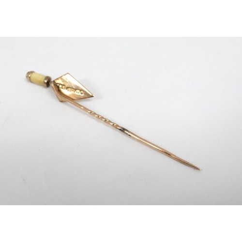 1118 - A 9ct gold stick pin surmounted by a 9ct gold miniature trowel.  The whole 2 ½'' long