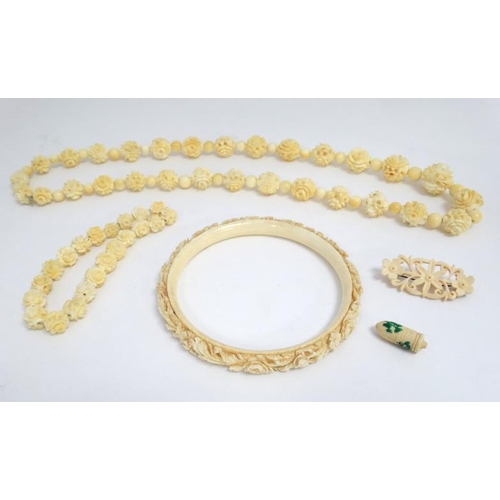 1123 - A 19thC Cantonese carved ivory bangle together with a bead necklace  (2)