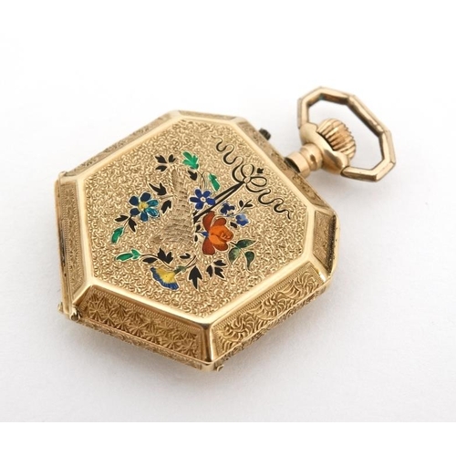 1130 - Enamel and 14 K gold Fob Watch: a French Heptagon top wind fobwatch profusely chased and decorated w... 