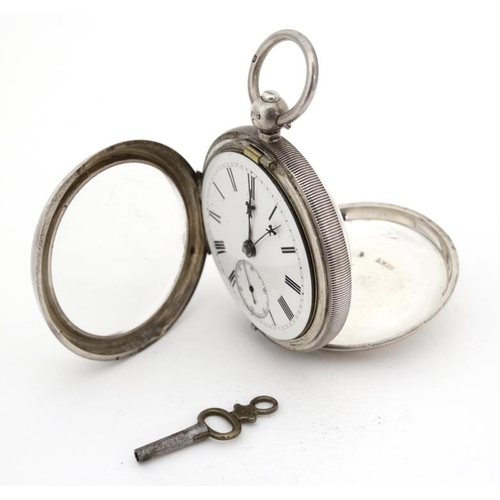 1139 - Chester HM silver Pocket Watch : a Key Wind open faced Pocketwatch, bearing inscription to dust cove... 