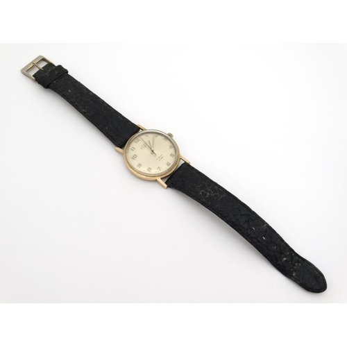 1151 - Wrist Watch : a 9 ct (.375) Gold cased Rotary Gents Wristwatch  with convex champagne coloured dial,... 