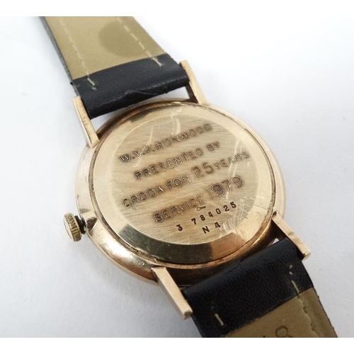 1152 - Bulova : a mechanical gentleman's 9 K gold cased wrist watch bears inscription to circular gilt dial... 