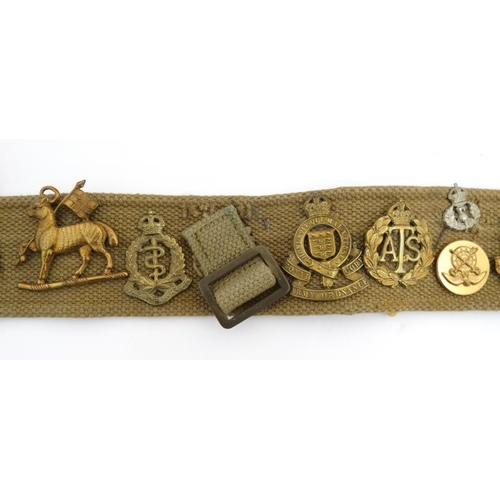 1159 - Militaria : A WWII webbing belt having applied cap badges of the 17th/21st Lancers , the Life Guards... 