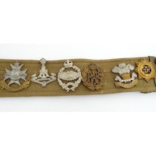 1159 - Militaria : A WWII webbing belt having applied cap badges of the 17th/21st Lancers , the Life Guards... 