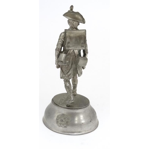 1161 - Militaria : A pewter model of an 18thC ensign of the Royal Sussex Regiment , the base signed ' Chas ... 