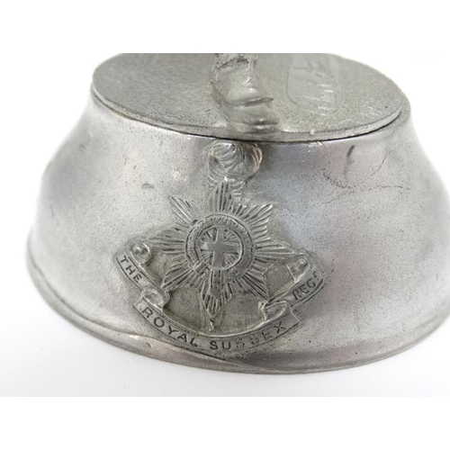 1161 - Militaria : A pewter model of an 18thC ensign of the Royal Sussex Regiment , the base signed ' Chas ... 