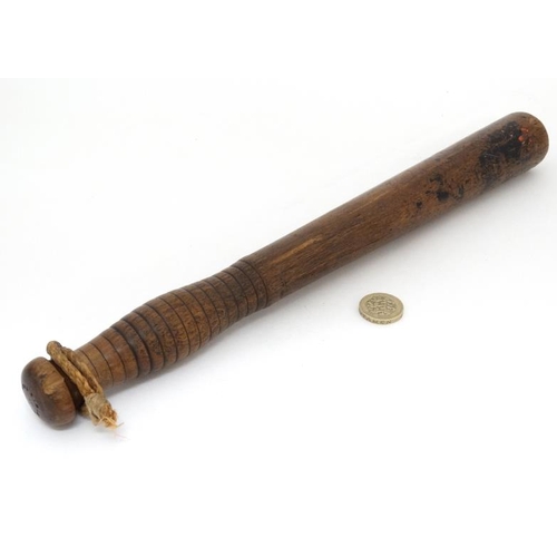 1167 - A Victorian hardwood turned Police Truncheon by Field , Holborn , London . The shaft having ribbed h... 