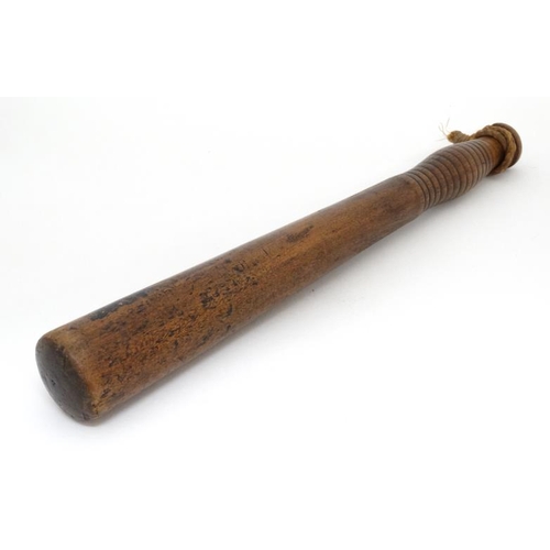 1167 - A Victorian hardwood turned Police Truncheon by Field , Holborn , London . The shaft having ribbed h... 