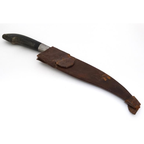 1169 - Militaria : A 19thC Eastern large fighting knife , the 10 3/4'' curved and swept steel blade having ... 