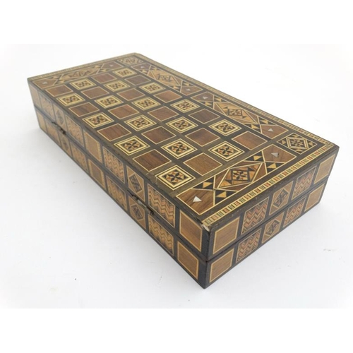 1183 - A mid 20thC Damascus folding chess and backgammon board with decorative wooden and mother of pearl m... 