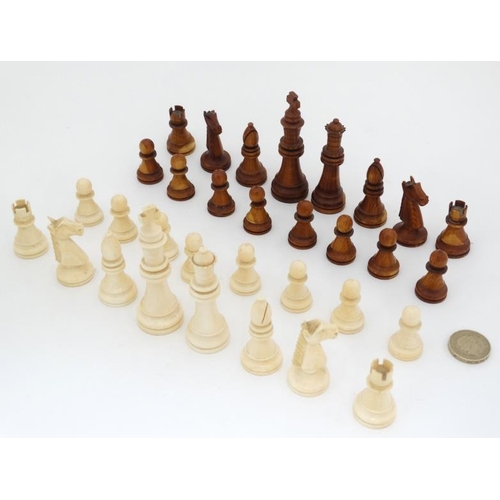 1184 - An early 20thC carved and stained brown and white ivory Staunton style chess set. The kings 3'' high... 