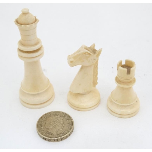 1184 - An early 20thC carved and stained brown and white ivory Staunton style chess set. The kings 3'' high... 