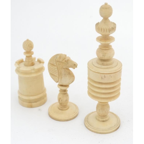 1185 - A carved and red stained bone Barleycorn Captain Cook style chess set in wooden box with mother of p... 