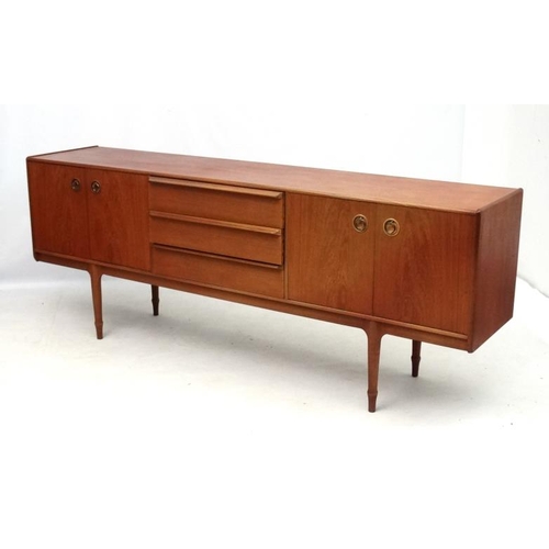 161 - Vintage Retro :    A British A H McIntosh & Co. Ltd., Kirkaldy  teak sideboard having three central ... 