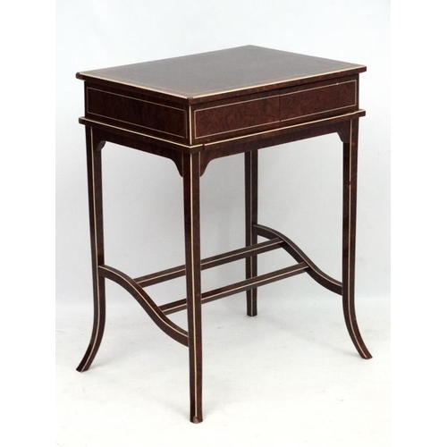 182 - Art Deco : A metamorphic amboyna writing table with strung and cross banded detail. In the manner of... 