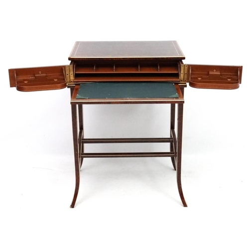 182 - Art Deco : A metamorphic amboyna writing table with strung and cross banded detail. In the manner of... 