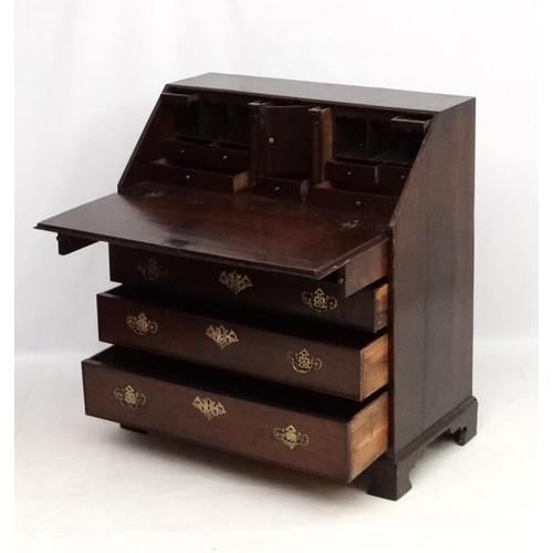 190 - A Geo III oak bureau having four graduated drawers  38'' wide x 20 1/2'' deep x 42'' high