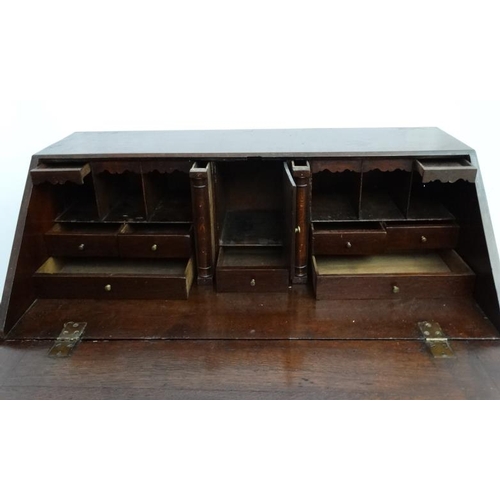 190 - A Geo III oak bureau having four graduated drawers  38'' wide x 20 1/2'' deep x 42'' high