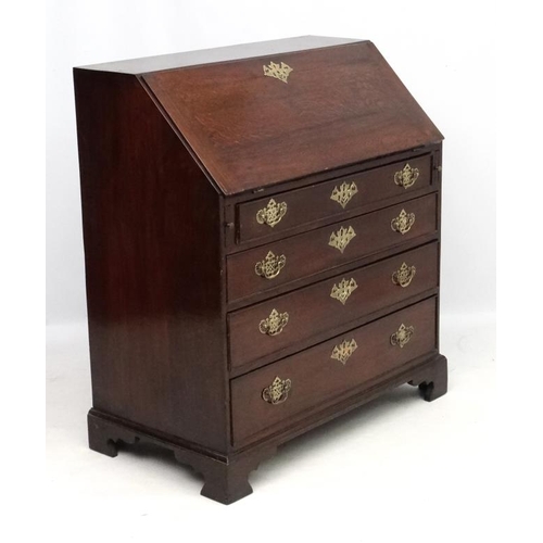 190 - A Geo III oak bureau having four graduated drawers  38'' wide x 20 1/2'' deep x 42'' high