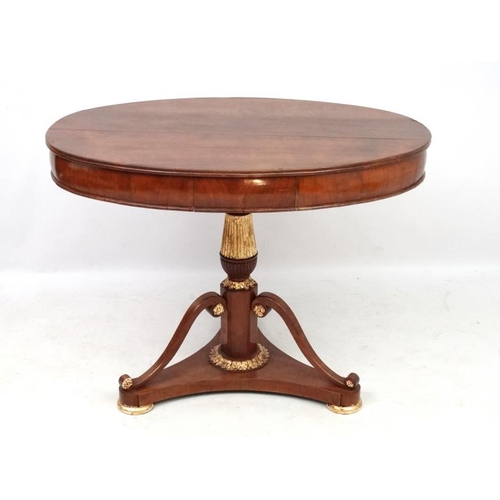 194 - A Biedemier fruit wood oval tripod table with central drawer. 40'' wide x 28'' deep x 31 1/4'' high