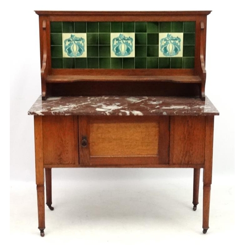 197 - A 19thC stained oak washstand with rouge marble top and tile back  42'' wide x 51'' high x 20 1/4'' ... 