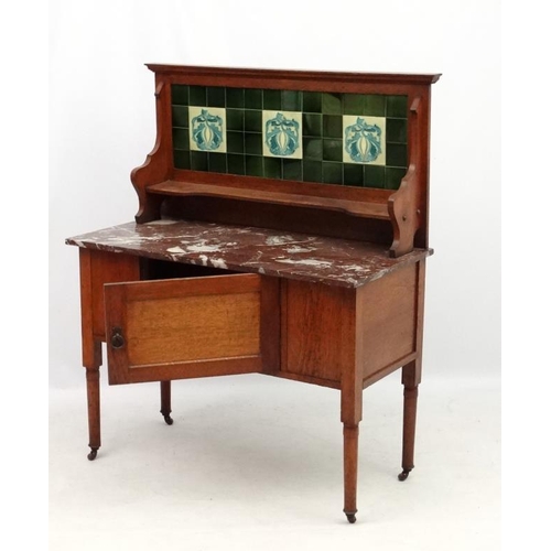 197 - A 19thC stained oak washstand with rouge marble top and tile back  42'' wide x 51'' high x 20 1/4'' ... 