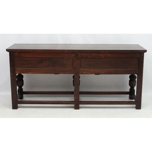 199 - Maple and Co , a 1920's oak Jacobean sideboard with three drawers, 72'' long x 33'' high x 18 3/4'' ... 