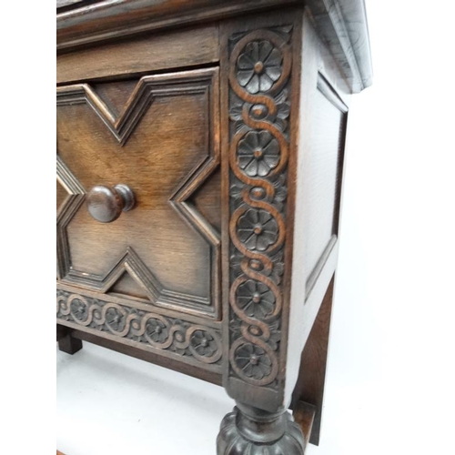 199 - Maple and Co , a 1920's oak Jacobean sideboard with three drawers, 72'' long x 33'' high x 18 3/4'' ... 