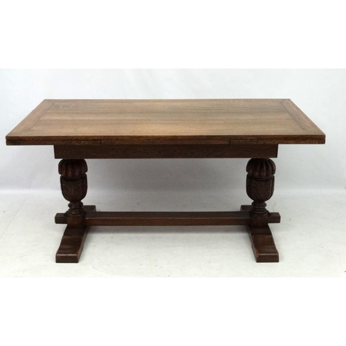 200 - An oak Jacobean style drawer leaf table and cup and cover trestle ends 30'' wide x 60 1/2'' (unexten... 