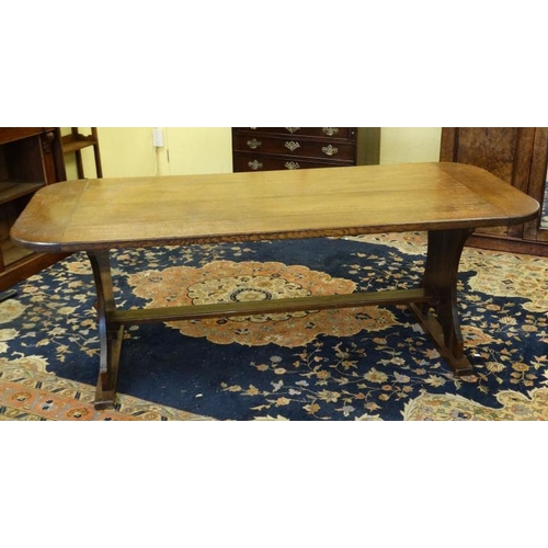 203 - An oak four panel refectory table with rounded corners and trestle ends 36'' wide x 84'' long