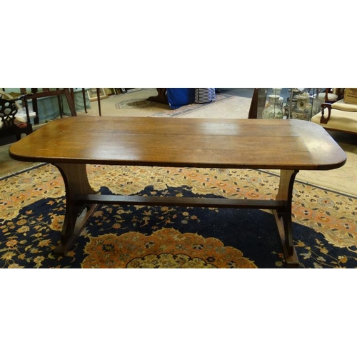 203 - An oak four panel refectory table with rounded corners and trestle ends 36'' wide x 84'' long