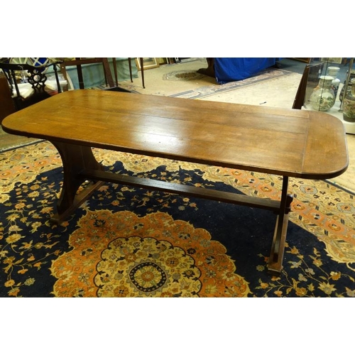 203 - An oak four panel refectory table with rounded corners and trestle ends 36'' wide x 84'' long