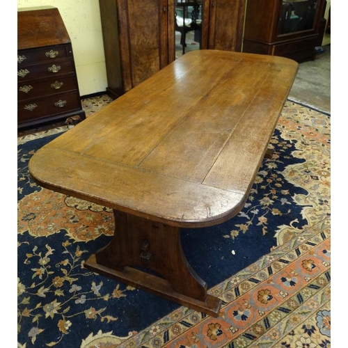 203 - An oak four panel refectory table with rounded corners and trestle ends 36'' wide x 84'' long