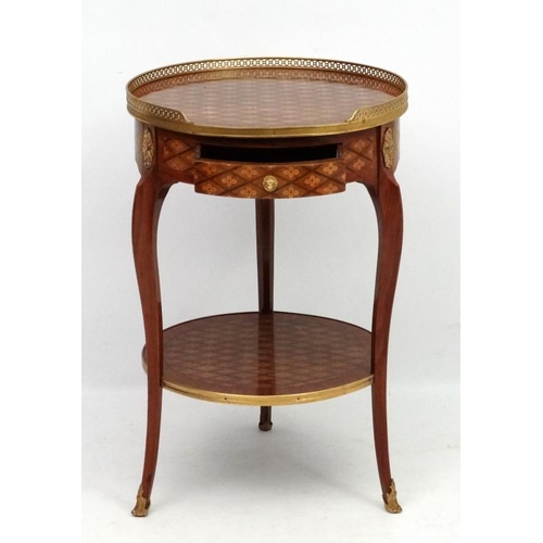 207 - A late 19thC / early 20thC French marquetry 2-tier circular centre table / etage with ormolu gallery... 