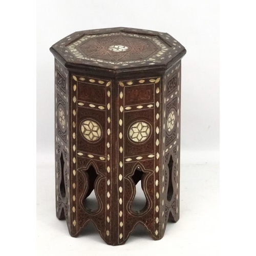 208 - An 18th/19thC Moorish (Islamic)  table of octagonal form with mother of pearl inlay. 13 1/4'' diamet... 