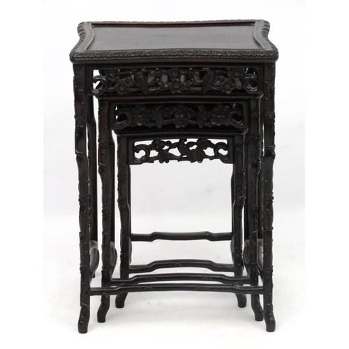 213 - Chinese : a patinated Zitan? Wood nest of three tables, with shaped legs, sides, front and back of t... 